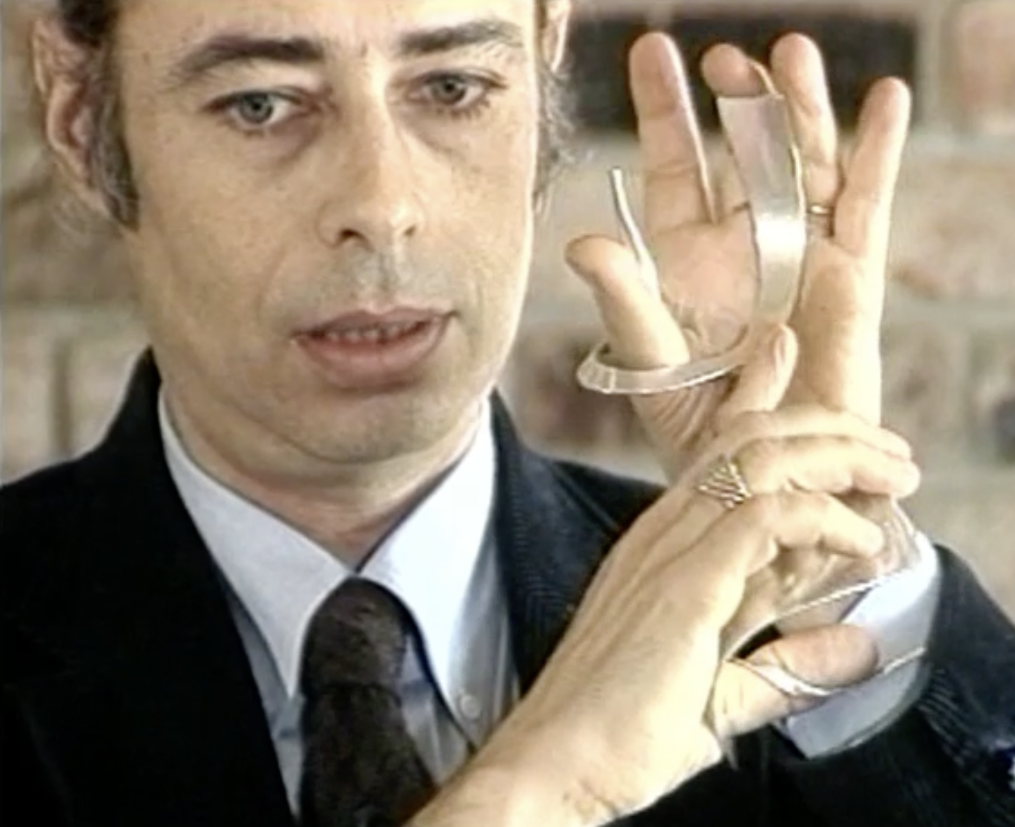 Stan Tenen demonstrating a Hebrew letter gesture with the First Hand Model